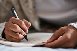 woman writing in notebook